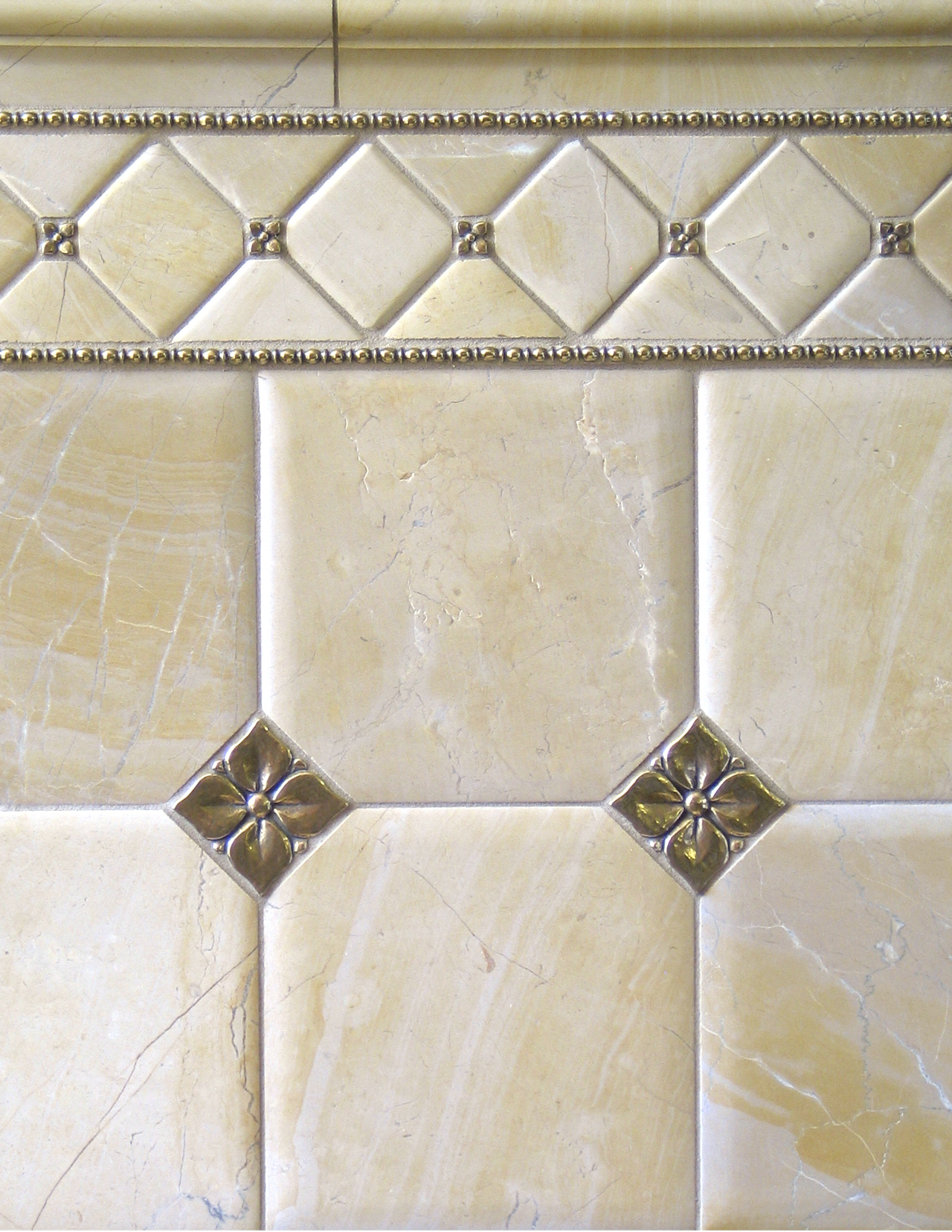 traditional bronze tile accent-liner limestone bathroom